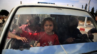 Syrians return to their homes in the town of Ayn al-Arus, south of the border town of Tal Abyad, after it was taken over by Turkish-backed Syrian fighters during their assault on Kurdish-held border towns in northeastern Syria. Syrian regime forces moved towards the Turkish border after Damascus reached a deal with beleaguered Kurdish forces following a US withdrawal announcement, AFP correspondents reported. AFP