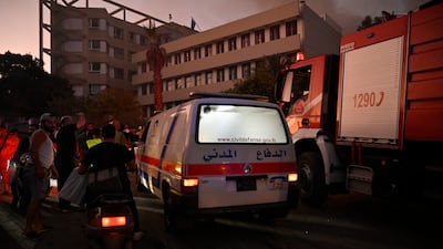 Ambulances attend to the injured following an Israel strike in Dahieh, south Beirut, on September 27. EPA