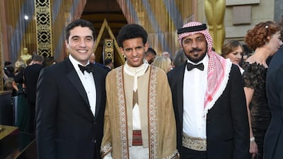 Naji Abu Nowar, from left, Jacir Eid, and Hassan Mutlag Al-Maraiyeh arrive at the Oscars at the Dolby Theatre in Los Angeles. Richard Shotwell / Invision / AP