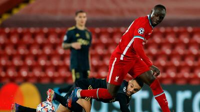 Liverpool forward Sadio Mane attempts to evade Ajax defender Noussair Mazraoui. AFP
