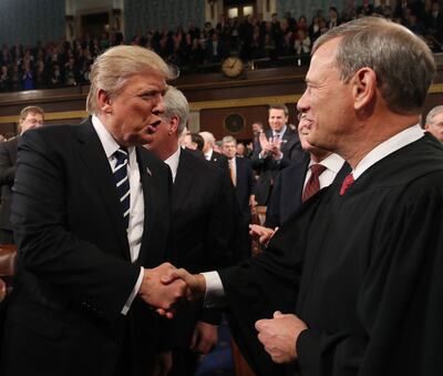 Donald Trump and US Supreme Court Chief Justice John Roberts pictured in 2017. AFP