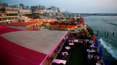 Palestinian families at a restaurant along the shore in Gaza City. AFP