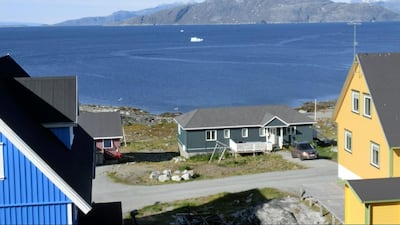 Sadelo mountain, also known as Sermitsiaq, can be seen surrounded by Nuup Kangerlua fjord, in Nuuk. AP Photo