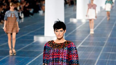 Stella Tennant presents a creation for Chanel for the spring/summer 2013 ready-to-wear collection in Paris. AFP