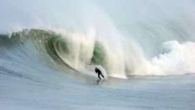 A surfer tackles an enormous swell at Maroubra Beach in Sydney.