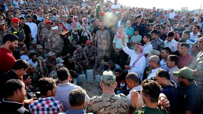 Jordanian security forces and relatives of Sergeant Hisham Aqarbeh attend his funeral in the town Birayn, north of the capital Amman. AFP