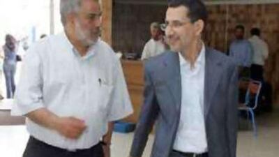 Abdelilah Benkiran, left, the leader of the Justice and Development Party, speaks with his predecessor, Saad Eddine Othmani, in Rabat.