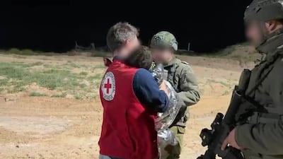 Israeli military hands over a Palestinian toddler to the Red Cross after the child was detained along with his father on March 19, 2026. Photo: Israeli military