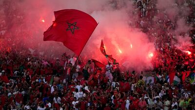 Morroco fans light flares before the match. AP