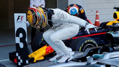 Lewis Hamilton celebrates on top of his Mercedes-GP car after winning the Japanese Grand Prix at Suzuka. Toru Hanai / Reuters