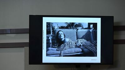 Evidence showing a picture of Heard appears on a screen. AFP