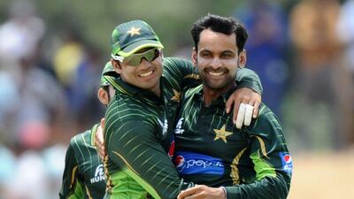 Mohammad Hafeez, right, took four wickets to restrict Sri Lanka before knocking a century to steer Pakistan to victory. Lakruwan Waniarchchi / AFP
