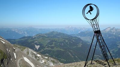 Swiss acrobat Ramon Kathriner performs during a ceremony marking the reopening of the Glacier 3000 cable car in Les Diablerets, Switzerland. Reuters