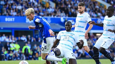 Everton midfielder Anthony Gordon is tackled by Chelsea's Senegalese defender Kalidou Koulibaly. AFP