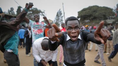 A supporter of the opposition leader Raila Odinga of the National Super Alliance (NASA) coalition jumps over a burning tyre as he and others protest after Odinga announced that he rejects the provisional result of the presidential election announced by the electoral body, in Kibera slum, one of Odinga's strongholds in Nairobi. DAI KUROKAWA / EPA
