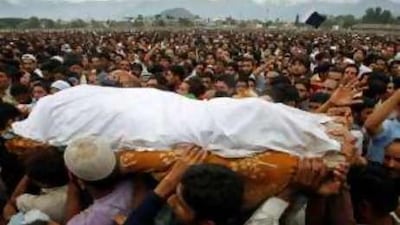 Kashmiri people carry the body of a youth shot dead by security forces.