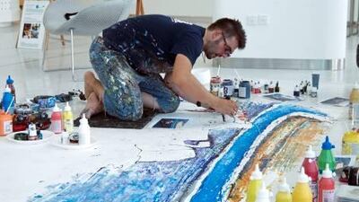 Ian Cook works on one of his race-car inspired creations at the Yas Marina Circuit. Courtesy Yasalam