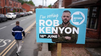 A Reform UK placard of their by-election candidate Robert Kenyon. Getty Images