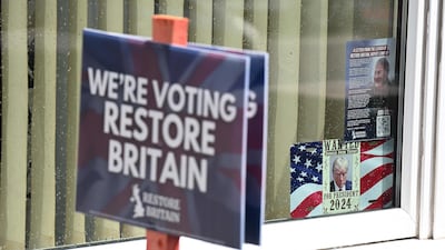 A banner for the Restore Britain political party. AFP