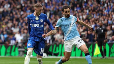 Chelsea's Cole Palmer vies for the ball with Manchester City's Bernardo Silva. AFP
