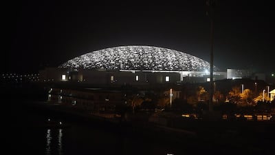 The Louvre Abu Dhabi construction site lights up the night on Saadiyat Island. Ravindranath K / The National