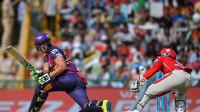 Rising Pune Supergiants batsman Faf Du Plessis, left, is watched by King’s Xi Punjab wicketkeeper Wriddhiman Saha. Sajjad Hussain / AFP