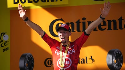 Stage 2 winner Kevin Vauquelin celebrates on the podium. AP