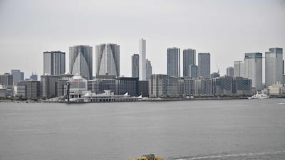 A boat sails through Tokyo bay. Japan is the latest country to announce a massive economic support package. AFP