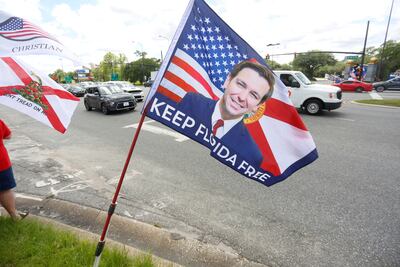 Supporters of Governor Ron DeSantis outside Walt Disney World in Orlando, Florida, April 16, 2022. Reuters