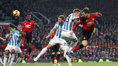 Manchester United's Victor Lindelof heads the ball. PA via AP