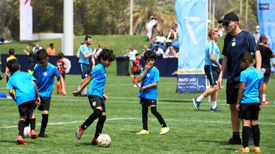 Techers Bahrain (blue) vs. Go Sports (red) under 8 age group.
