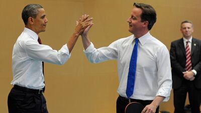 Barack Obama and Mr Cameron play table tennis at the Globe Academy in south London during the US President's state visit to Britain in May 2011
