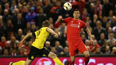 Dejan Lovren of Liverpool in action with Lukasz Piszczek of Borussia Dortmund. Clive Brunskill / Getty Images