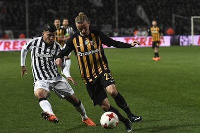 AEK's Swedish midfielder Niklas Hult, right, outruns PAOK's forward Dimitris Limnios during their Superleague match in Thessaloniki. Sakis Mitrolidis / AFP