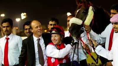 Trainer Ernst Oertel, centre left, visited the winner's circle four times on Sunday night at the Abu Dhabi Equestrian Club, with and jockey Tadhg O'Shea making the trip with him three times, once aboard Skoop.