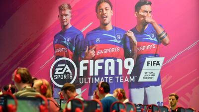 Visitors try out the latest FIFA 19 video game at the Gamescom fair in Cologne, Germany on August 21, 2018. AP Photo