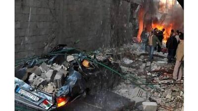 Syrians inspect the damage from one of Wednesday's car bombings. A reader says the killing must stop. AFP / STR