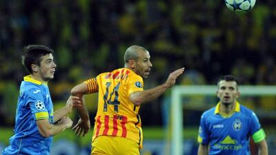 Barcelona’s Javier Mascherano heads the ball away from Bate Borisov’s Evgeni Yablonski during their match on Tuesday night in the Champions League. Sergei Gapon / AFP