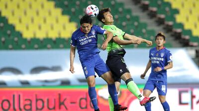 Lee Dong-Gook goes up for a header against the Bluewings. Getty Images