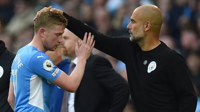 Pep Guardiola, right, says Kevin De Bruyne 'cannot perform incredibly well all the time' due to amount of football he has played in recent seasons. EPA