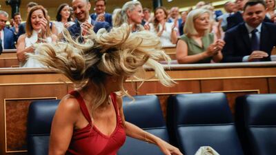 Spain's acting Labour Minister Yolanda Diaz takes her seat amid applause in the Lower House of the Spanish parliament, in Madrid. EPA
