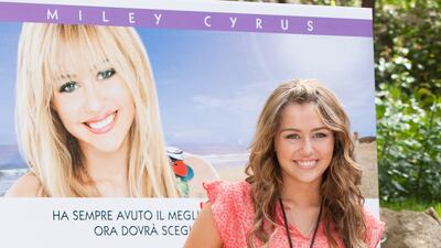 Miley Cyrus, in jeans and a coral blouse, attends the 'Hannah Montana:The Movie' photo call at De Russie Hotel on April 20, 2009 in Rome, Italy. Getty Images