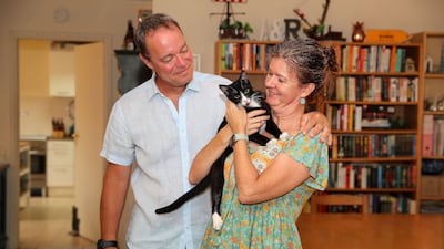 Andreas and Rowena Selwood with one of their eight cats at their villa in Dubai's Jumeirah 3. All photos: Pawan Singh / The National