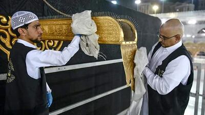 Teams clean the Kabaa in Makkah's Grand Mosque. HO