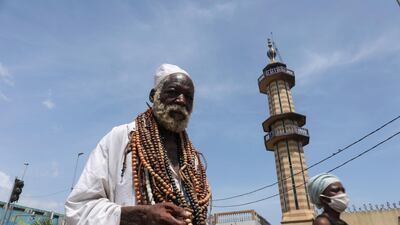 A man walks near the mosque of Adjame during the holy month in Abidjan, Ivory Coast. Reuters