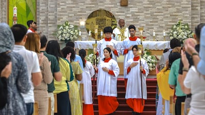 Easter Sunday service at St Therese Church in Abu Dhabi. Parishioners from all corners of the globe who call the UAE home united in a show of solidarity and celebration of their faith. Victor Besa / The National