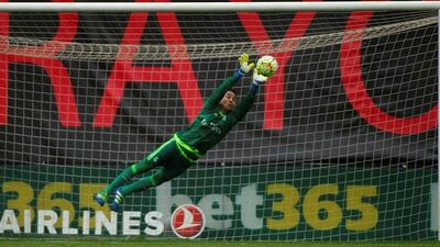 Real Madrid’s Costa Rican goalkeeper Keylor Navas jumps to catch the ball during the Spanish league football match Rayo Vallecano de Madrid vs Real Madrid CF at the Vallecas stadium in Madrid on April 23, 2016. Curto de la Torre/AFP