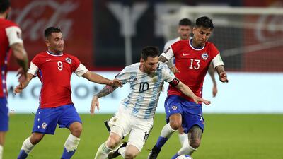Lionel Messi evads challenges from Jean Meneses and Erick Pulgar. Getty Images