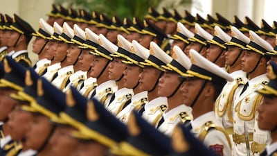 Chinese honour guards prepare for the arrival of German Chancellor Angela Merkel and Chinese Premier Li Keqiang in Beijing. Wang Zhao / AFP Photo