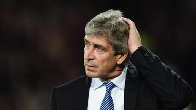 Manchester City manager Manuel Pellegrini observes his side on Monday night during their Premier League loss to Crystal Palace. Jamie McDonald / Getty Images